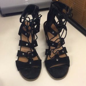 moderately used lace up black sandals